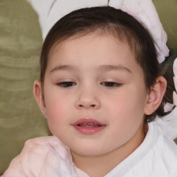 Joyful white child female with short  brown hair and brown eyes