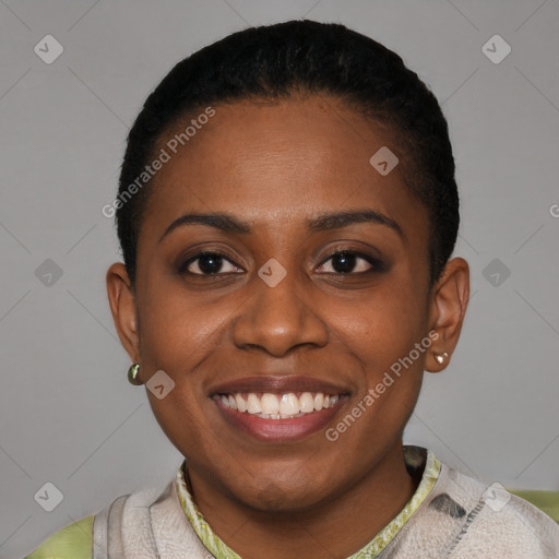 Joyful black young-adult female with short  black hair and brown eyes