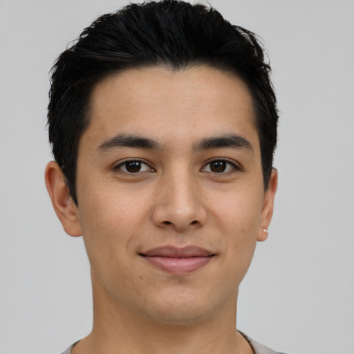 Joyful asian young-adult male with short  black hair and brown eyes