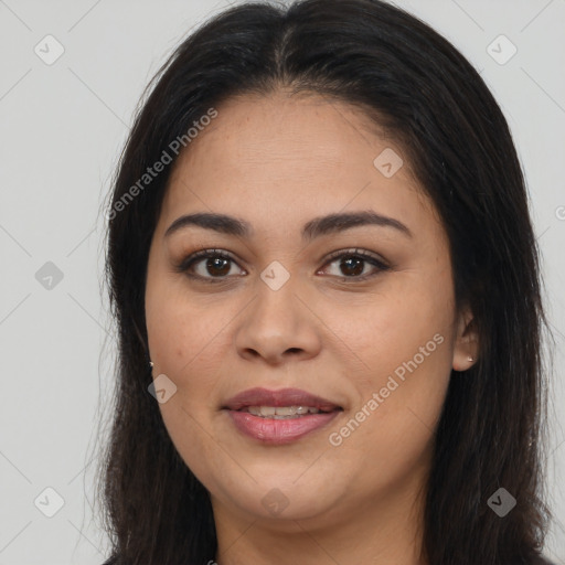 Joyful latino young-adult female with long  brown hair and brown eyes