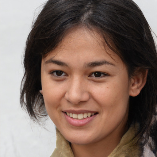 Joyful white young-adult female with medium  brown hair and brown eyes