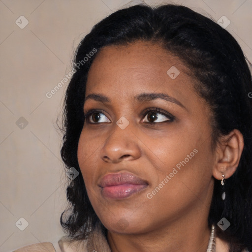 Joyful black young-adult female with medium  black hair and brown eyes