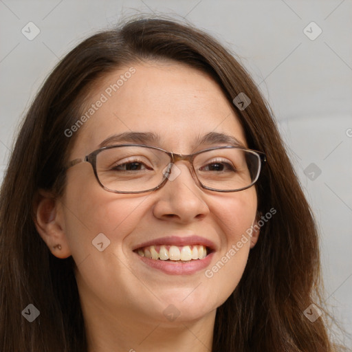 Joyful white adult female with long  brown hair and brown eyes