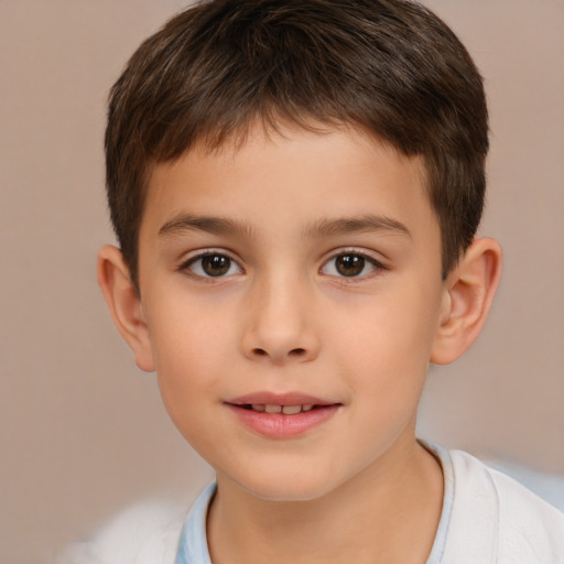 Joyful white child male with short  brown hair and brown eyes