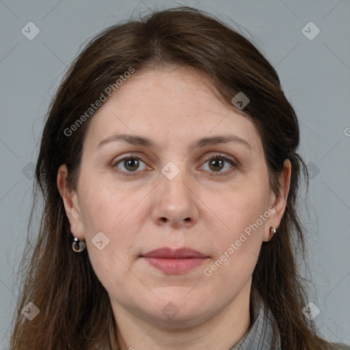 Joyful white adult female with long  brown hair and brown eyes