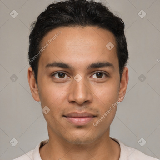 Joyful white young-adult male with short  black hair and brown eyes