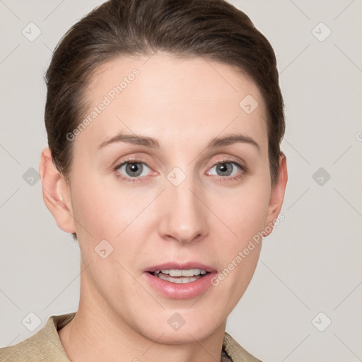 Joyful white young-adult female with short  brown hair and grey eyes