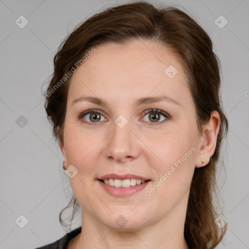 Joyful white young-adult female with medium  brown hair and blue eyes