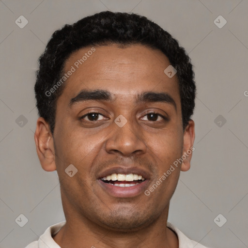Joyful black young-adult male with short  black hair and brown eyes