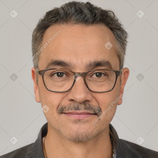 Joyful white adult male with short  brown hair and brown eyes