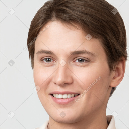 Joyful white young-adult female with short  brown hair and brown eyes