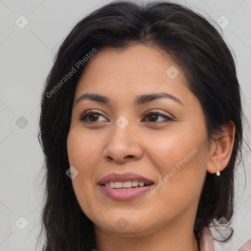 Joyful latino young-adult female with long  brown hair and brown eyes