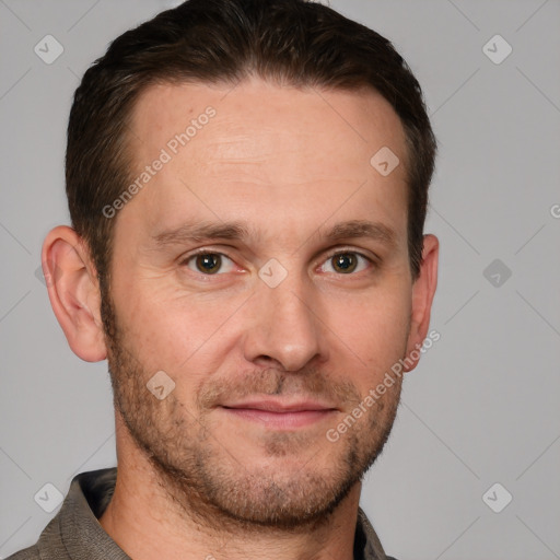 Joyful white adult male with short  brown hair and grey eyes