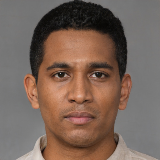 Neutral latino young-adult male with short  black hair and brown eyes