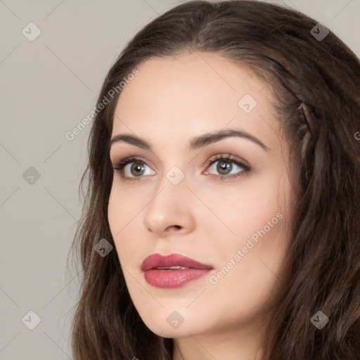 Neutral white young-adult female with long  brown hair and brown eyes