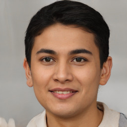 Joyful asian young-adult male with short  brown hair and brown eyes