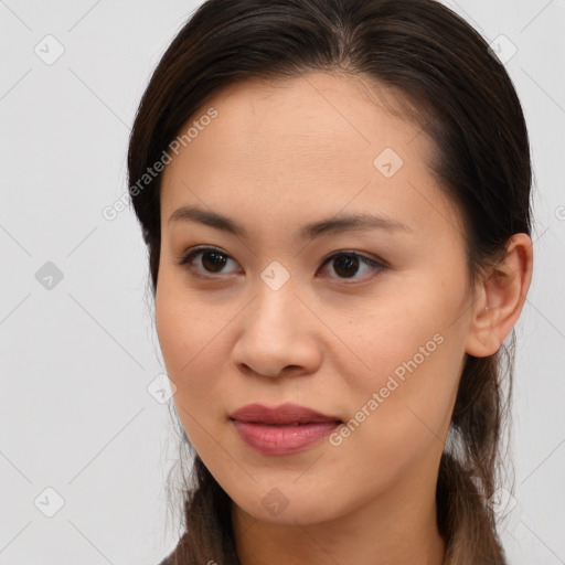 Joyful white young-adult female with long  brown hair and brown eyes