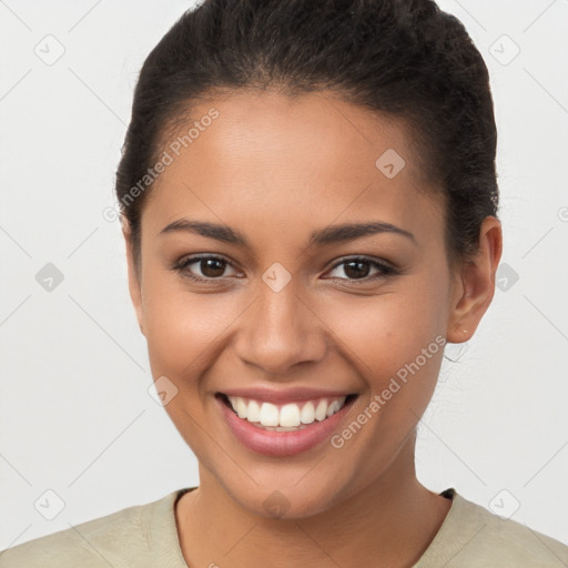 Joyful latino young-adult female with short  brown hair and brown eyes