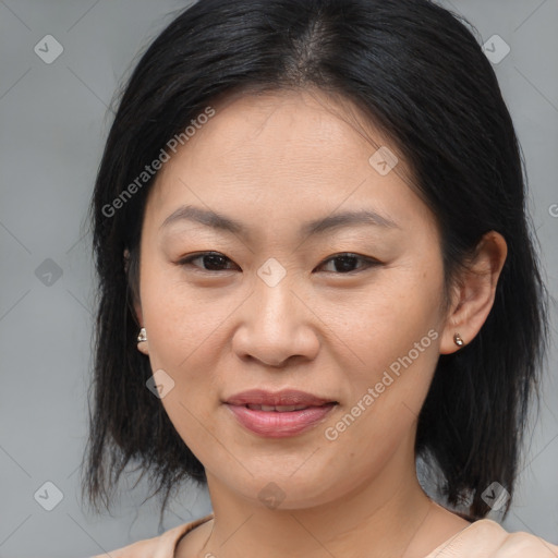 Joyful asian young-adult female with medium  brown hair and brown eyes