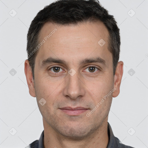 Joyful white adult male with short  brown hair and brown eyes