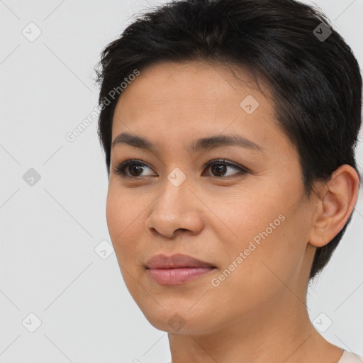 Joyful asian young-adult female with short  brown hair and brown eyes