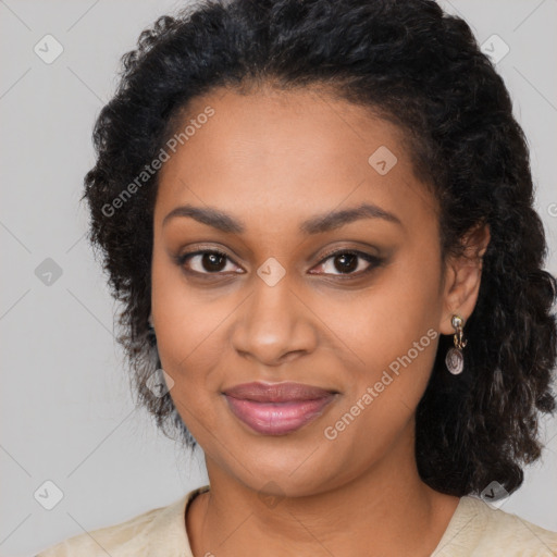 Joyful black young-adult female with long  black hair and brown eyes