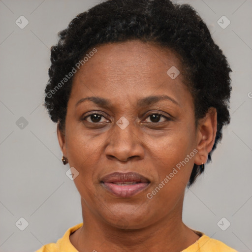 Joyful black adult female with short  brown hair and brown eyes