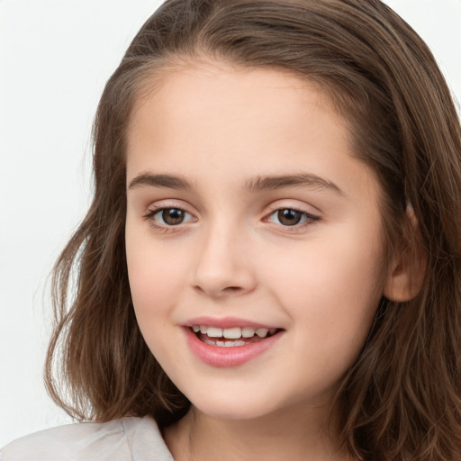 Joyful white child female with long  brown hair and brown eyes