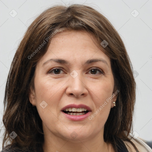 Joyful white adult female with medium  brown hair and brown eyes