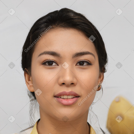 Joyful asian young-adult female with medium  black hair and brown eyes