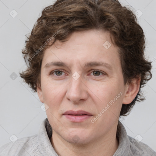 Joyful white adult male with short  brown hair and grey eyes