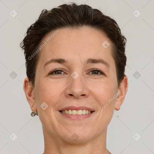 Joyful white adult female with short  brown hair and brown eyes