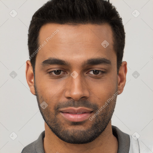 Joyful white young-adult male with short  black hair and brown eyes