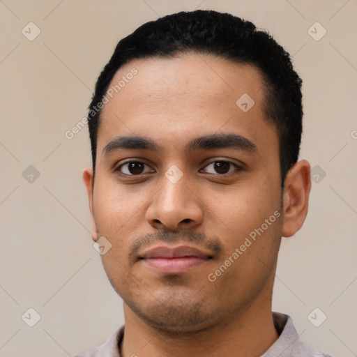 Neutral latino young-adult male with short  black hair and brown eyes