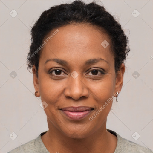 Joyful black adult female with short  brown hair and brown eyes