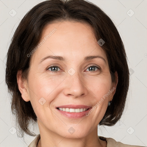 Joyful white adult female with medium  brown hair and grey eyes