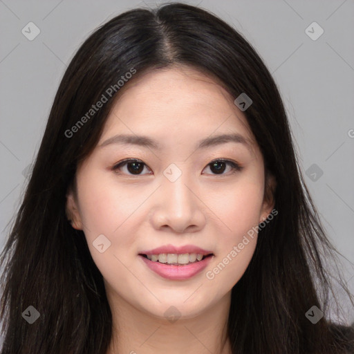 Joyful asian young-adult female with long  brown hair and brown eyes