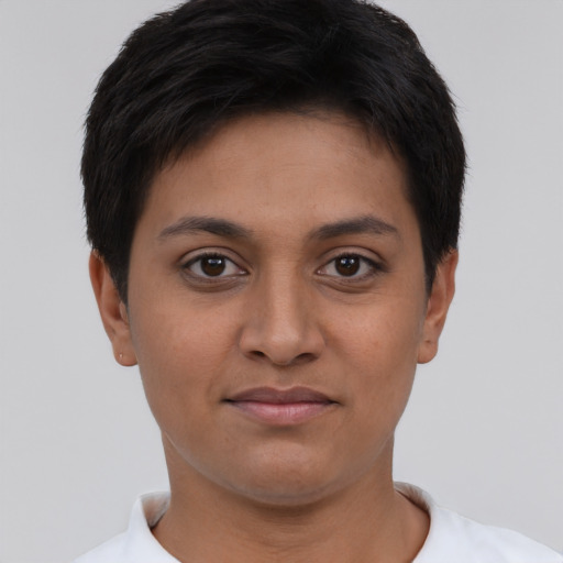 Joyful latino young-adult female with short  brown hair and brown eyes