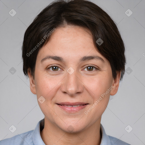 Joyful white adult female with short  brown hair and brown eyes