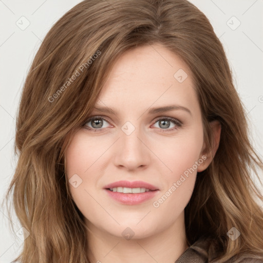 Joyful white young-adult female with long  brown hair and blue eyes