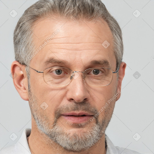 Neutral white middle-aged male with short  gray hair and brown eyes