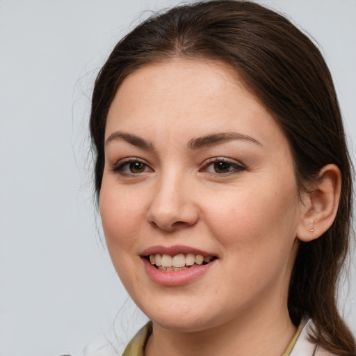 Joyful white young-adult female with medium  brown hair and brown eyes