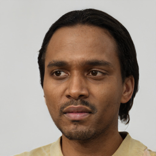 Neutral black young-adult male with short  black hair and brown eyes