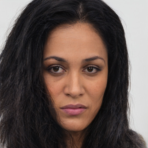 Neutral black young-adult female with long  brown hair and brown eyes