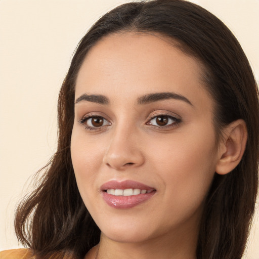 Joyful white young-adult female with long  brown hair and brown eyes