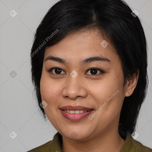 Joyful asian young-adult female with medium  brown hair and brown eyes