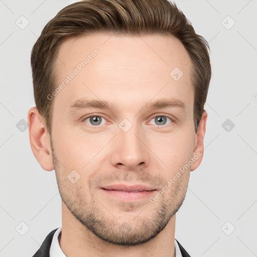 Joyful white young-adult male with short  brown hair and grey eyes