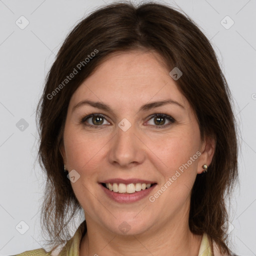 Joyful white young-adult female with medium  brown hair and green eyes