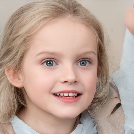 Joyful white child female with medium  blond hair and blue eyes