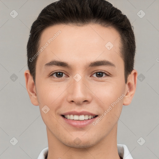 Joyful white young-adult male with short  brown hair and brown eyes